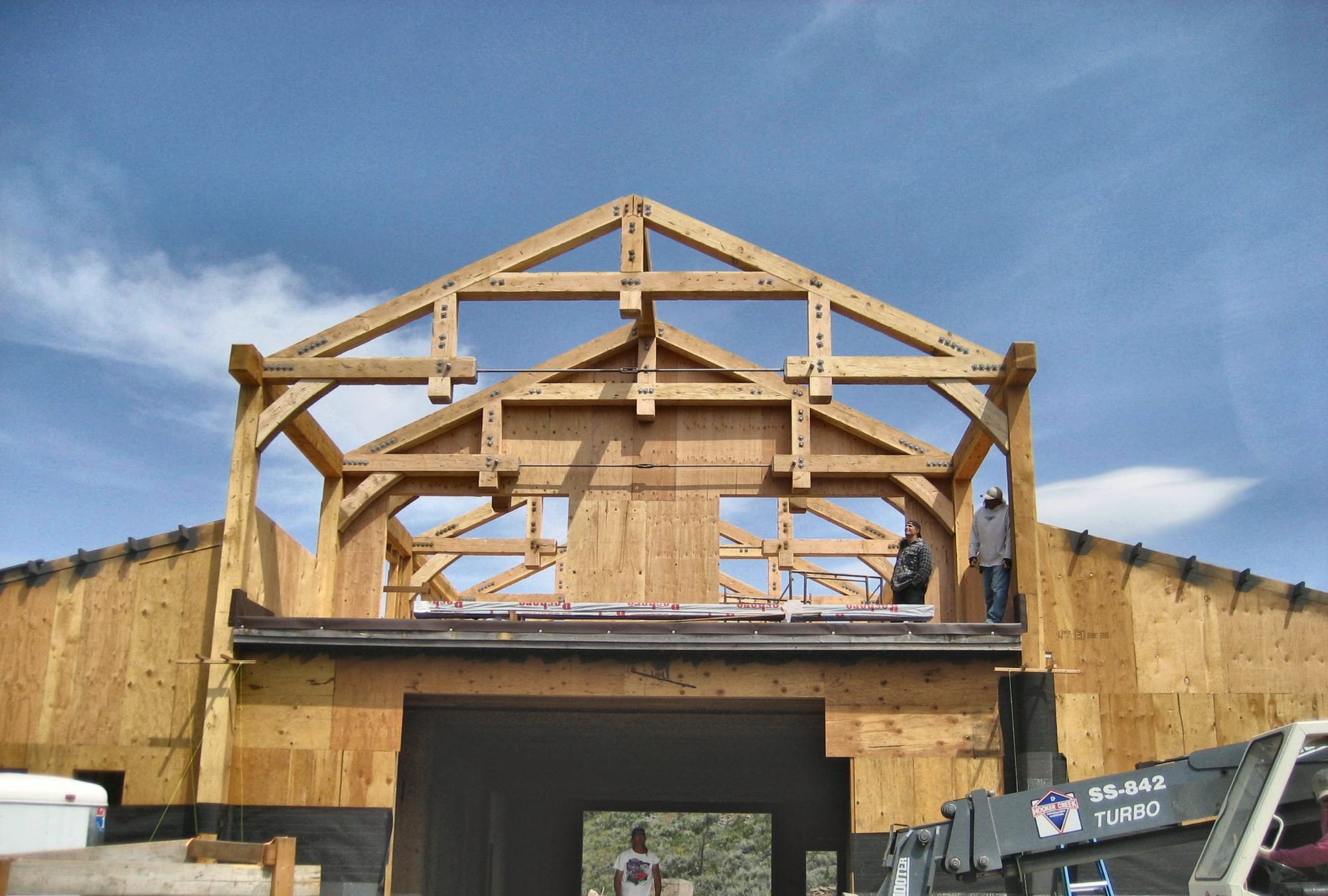 Heavy timber trusses raised on a new building